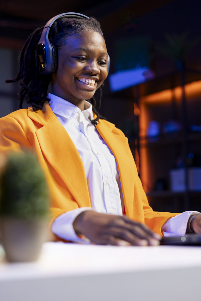 joyous woman laughing, watching funny comedy movie on laptop joyous woman laughing, watching funny comedy movie on laptop
